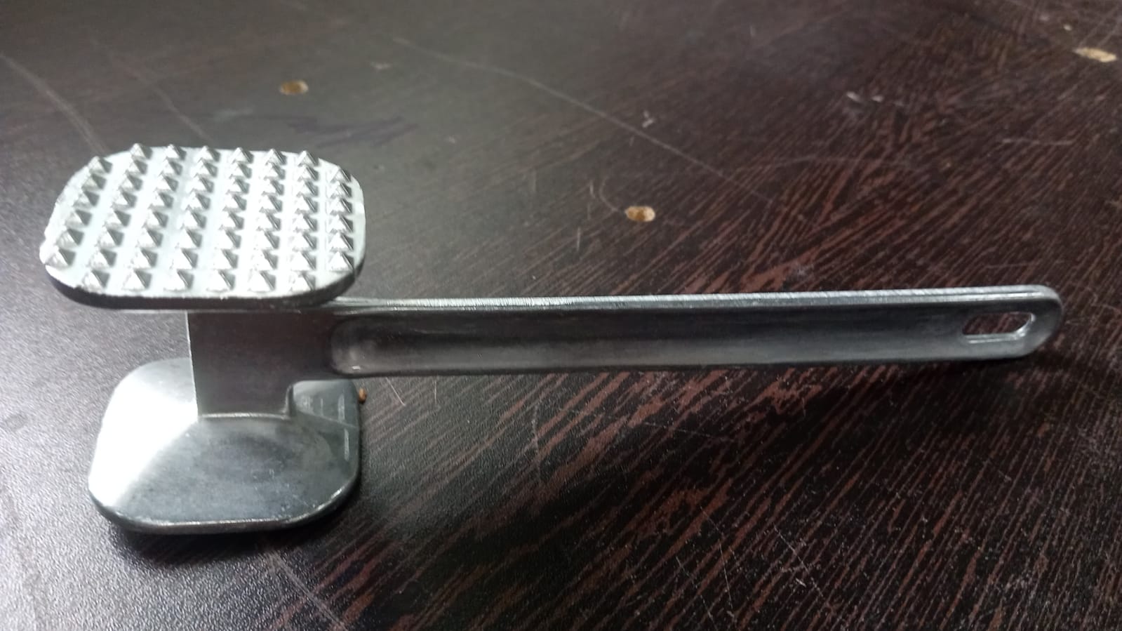 Heavy-duty meat hammer, perfect for tenderizing beef. Heavy-duty meat hammer, perfect for tenderizing beef.
